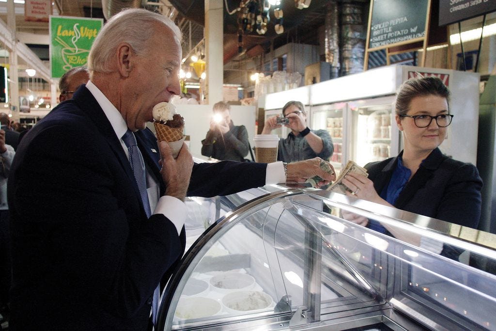 In this January 2012 file photo, then-Vice President Joe Biden, enjoys an ice cream cone from Jeni Britton Bauer, owner of Jeni's Ice Cream, during a brief stop at North Market.