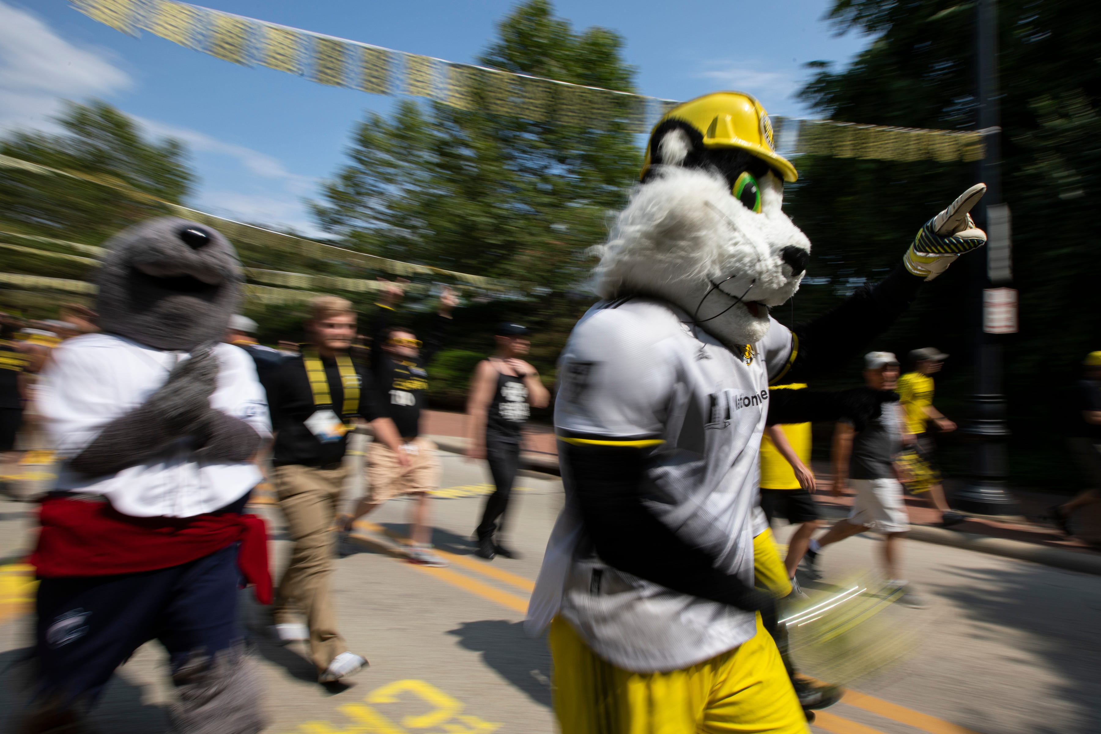 The Columbus Crew mascot, S.C. marches with fans to Lower.com Field before the soccer game against the New England Revolution in Columbus, Ohio July 3.