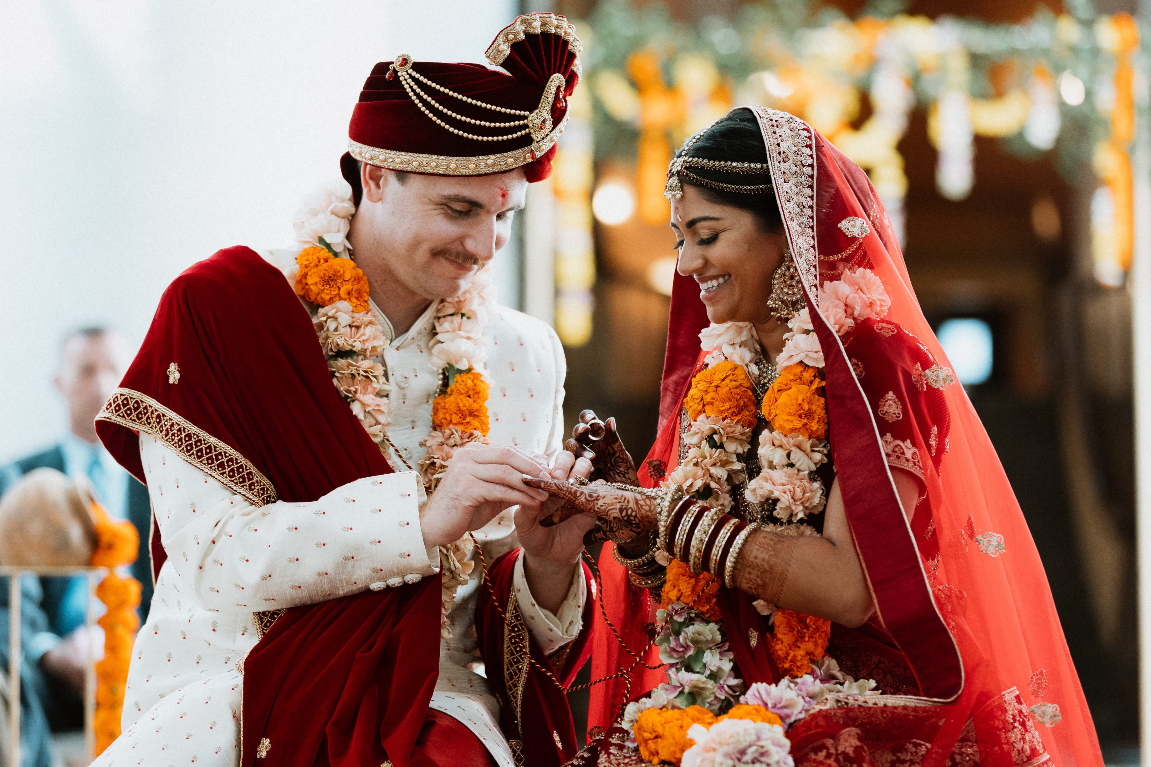 Riddhi and Brennon Cain exchange rings during their wedding ceremony.